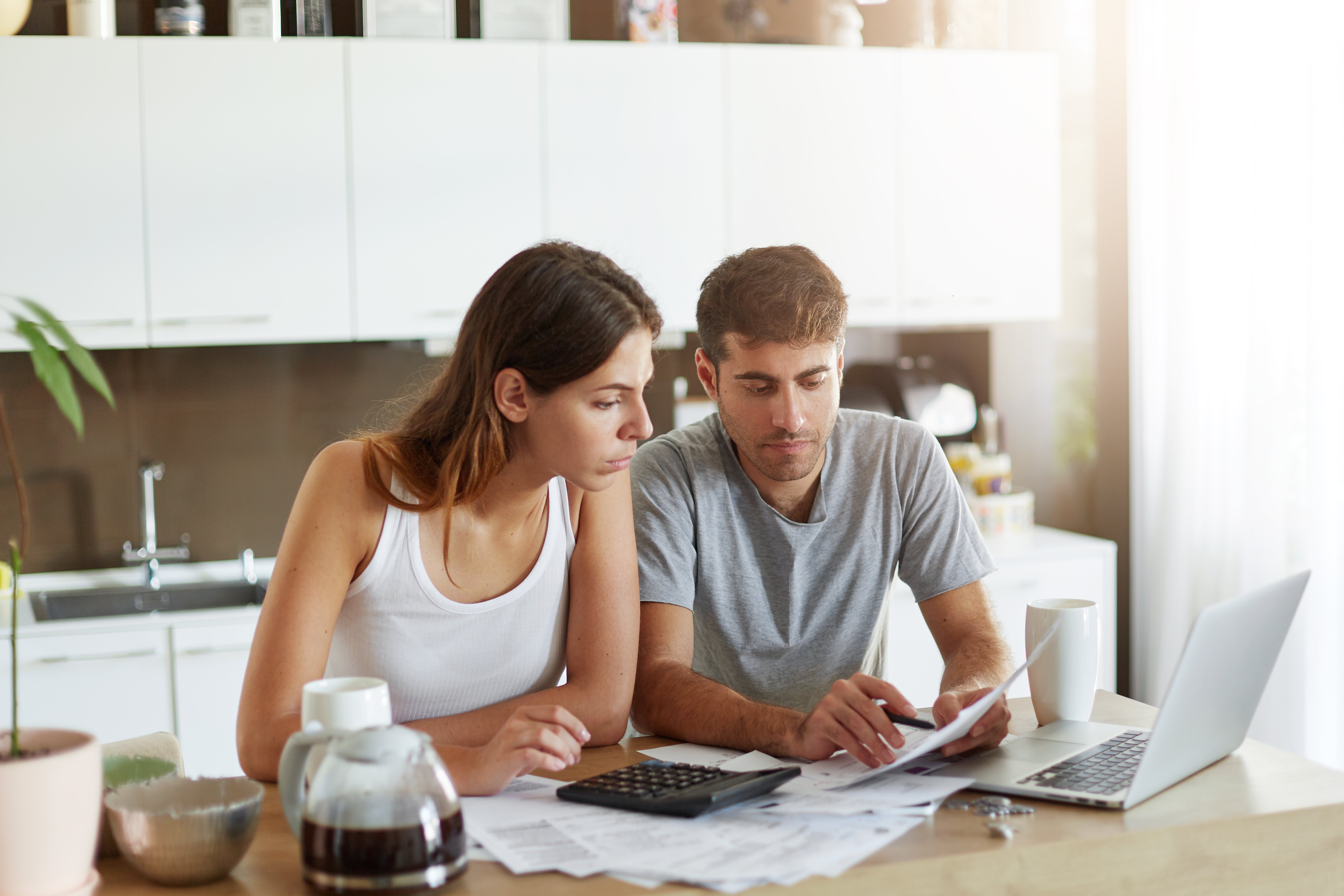 young-couple-checking-their-family-budget